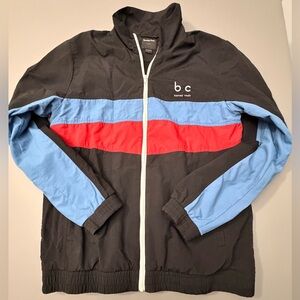 Barney Cools Black Windbreaker with Red and Blue Accents‎